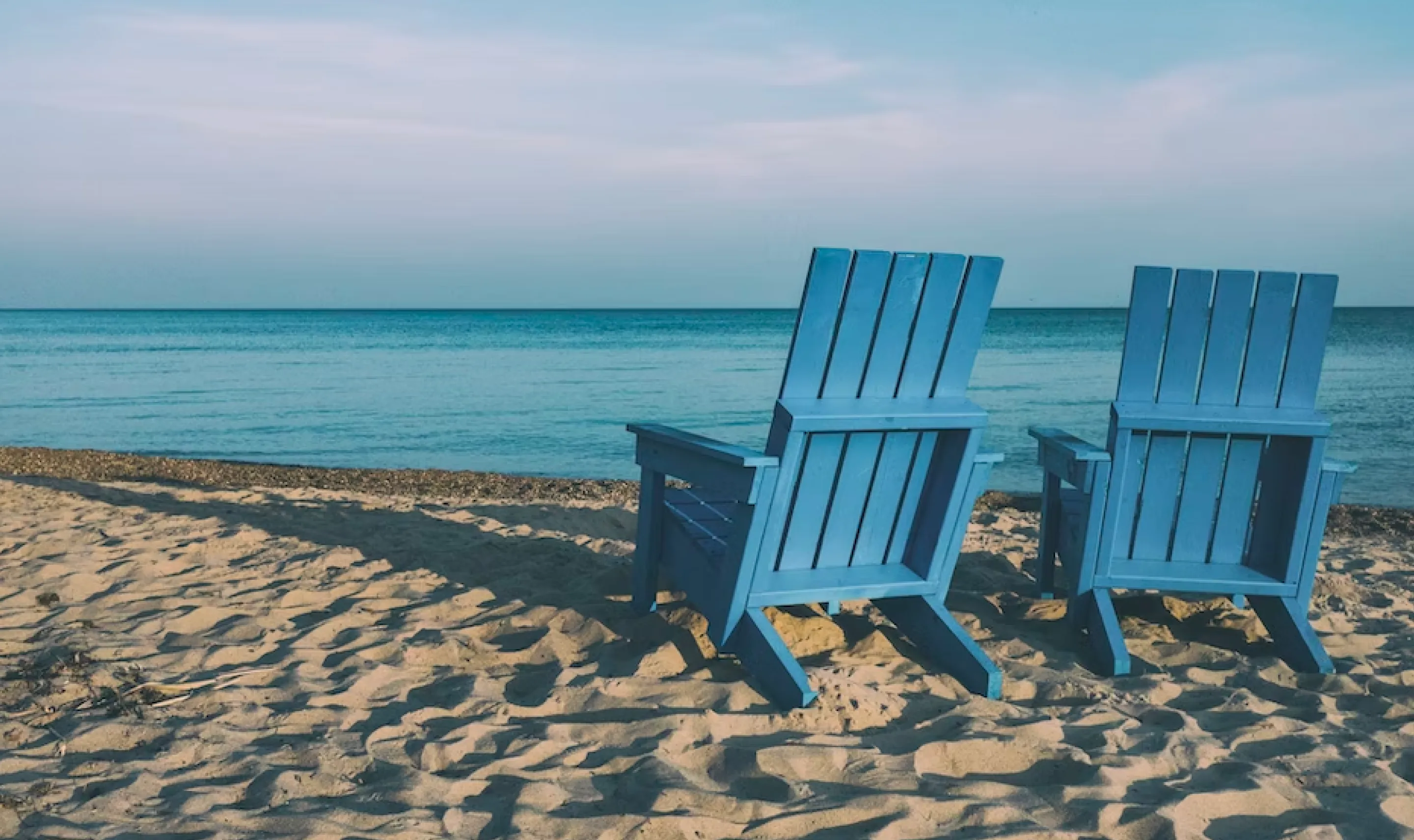 Wood sunbeds on beach background